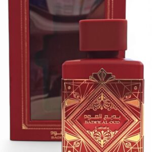 Un frasco de perfume negro con la etiqueta Lattafa Asad Zanzibar EDP 100ml con detalles dorados se encuentra delante de una caja negra y dorada a juego, ambas adornadas con elegantes motivos y escritura árabe.