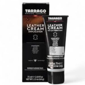 Un tubo negro de Crema Betún Tarrago para Cuidado del Cuero y la Piel, 75 ml, frente a su caja negra a juego, ambas con texto en blanco y naranja.