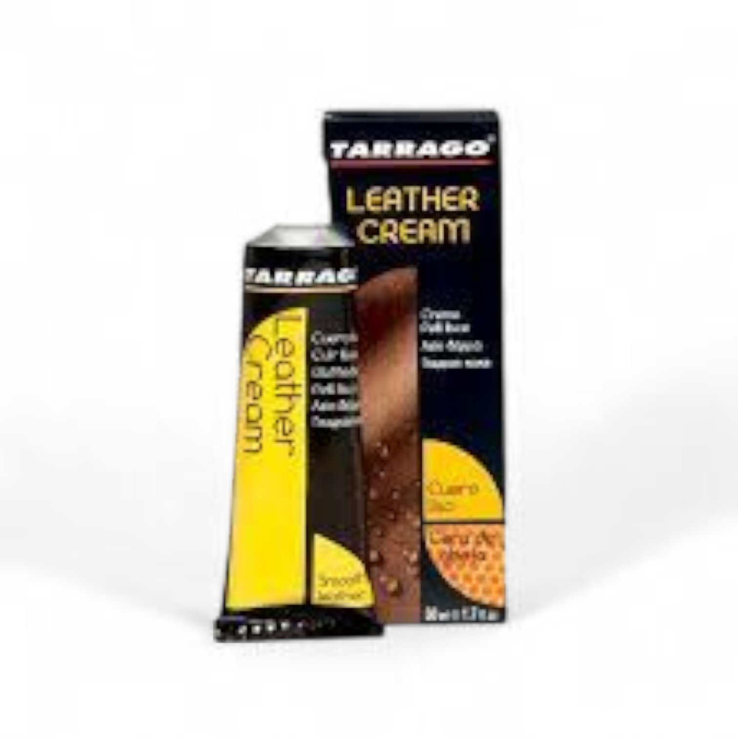 Un tubo de Crema Betún Tarrago para Cuidado del Cuero y la Piel se encuentra delante de su caja a juego, ambas diseñadas para acondicionar y abrillantar el cuero. El envase utiliza colores negro, amarillo y marrón.