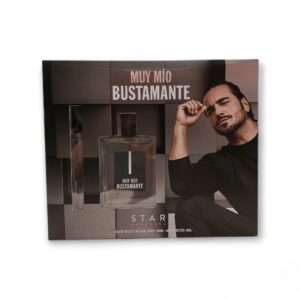 Un estuche etiquetado Bustamante Muy mio EDT 100 + 10ml con un frasco, un pulverizador y una foto en blanco y negro de un hombre con el pelo peinado hacia atrás posando pensativo. En la parte inferior aparece impreso "Stars Academy".