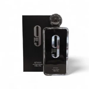 Afnan 9PM EDP 100ml se presenta en un elegante frasco negro con la etiqueta "9PM" y su caja a juego, ambas con la marca Afnan y un tamaño de 100 ml.